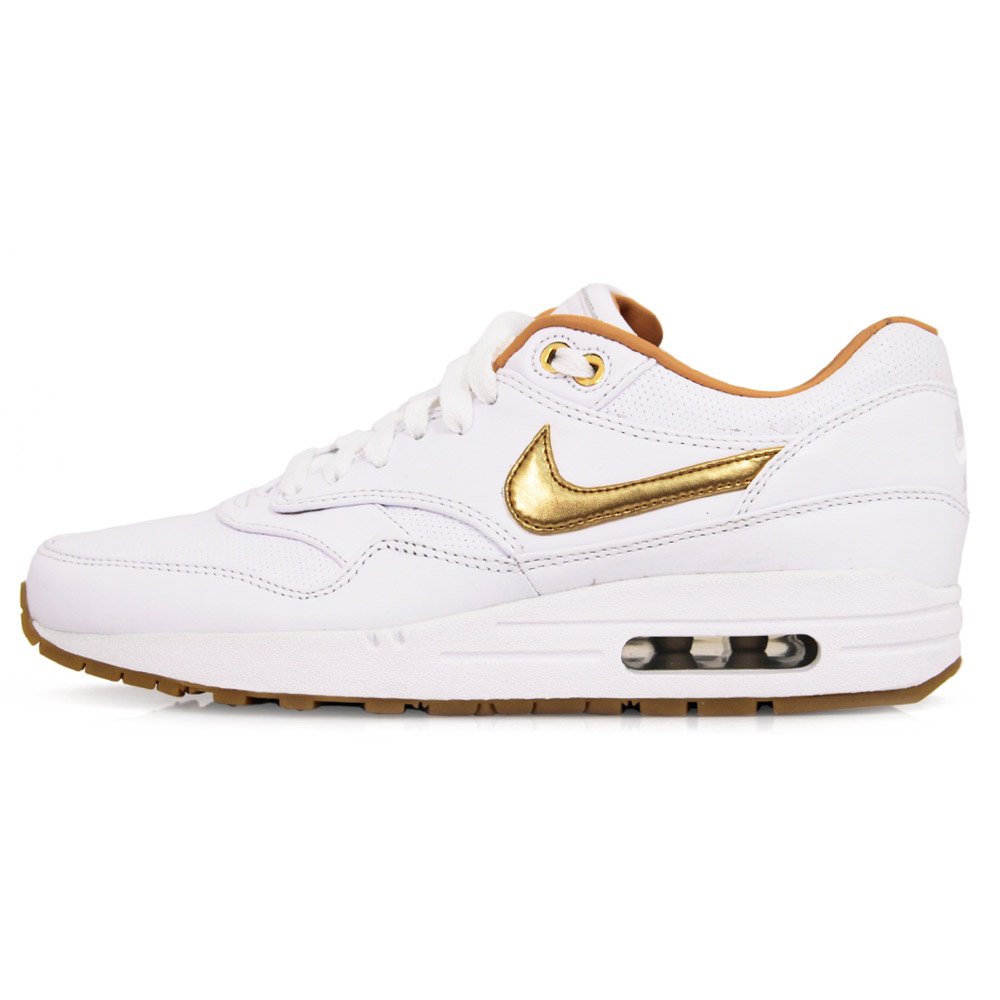 gold and white nike sneakers